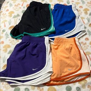 Lot of 4 women’s medium Nike dri-fit shorts classic running sports activewear